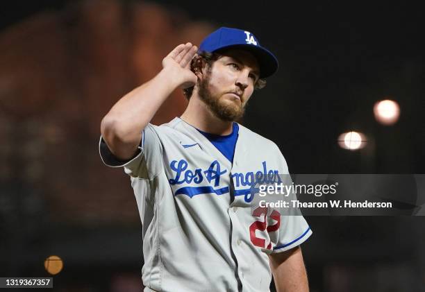 Trevor Bauer of the Los Angeles Dodgers reacts to fans booing him as he leaves the game against the San Francisco Giants in the seventh inning at...