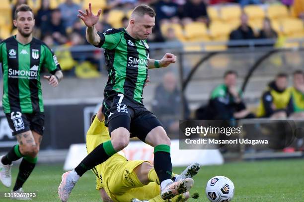 Besart Berisha of the Western United FC competes for the ball with Cameron Devlin of the Wellington Phoenix during the A-League match between...