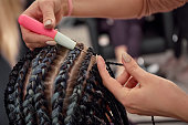 Beauty salon master works, Afro-braids and dreadlocks