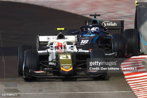 Ralph Boschung of Switzerland and Campos Racing drives as Roy Nissany of Israel and DAMS crashes into the wall behind during Sprint Race 2 of Round...