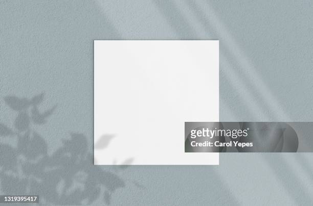 blank  square paper mock up.grey background.shadows - notepad table stock pictures, royalty-free photos & images