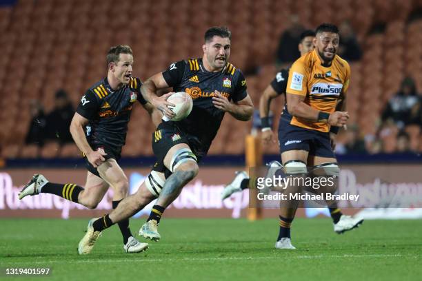 Luke Jacobson of the Chiefs makes a break during the round two Super Rugby Trans-Tasman match between the Chiefs and the ACT Brumbies at FMG Stadium...