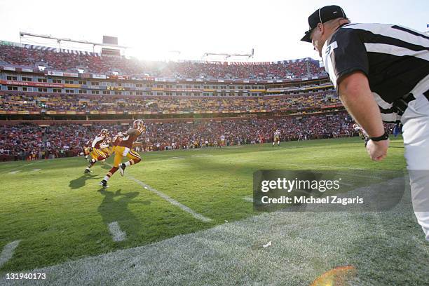 Umpire Bill Schuster watches as the Washington Redskins kick the ball off during the game against the San Francisco 49ers at FedEx Field on November...