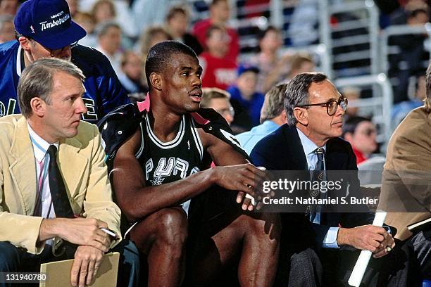 San Antonio Spurs head coach Larry Brown, Assistant Coach Gregg Popovich and David Robinson sit on the bench circa 1989 at Madison Square Garden in...