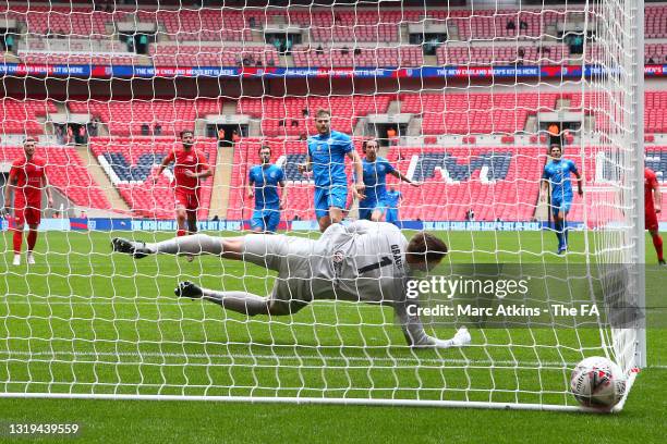 Elliott Nevitt of Warrington Rylands scores their sides second goal from the penalty spot past Chris Grace of Binfield during the FA Vase Final...