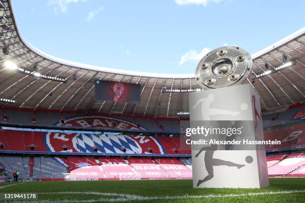 General view inside the stadium as the Bundesliga Meisterschale Trophy is seen on a plinth ahead of the Bundesliga match between FC Bayern München...