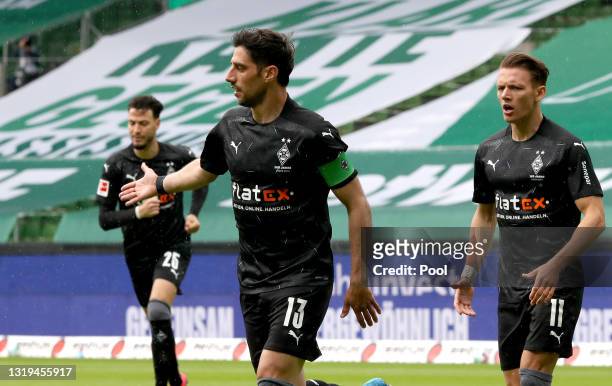 Lars Stindl of Borussia Moenchengladbach celebrates after scoring their team's first goal during the Bundesliga match between SV Werder Bremen and...