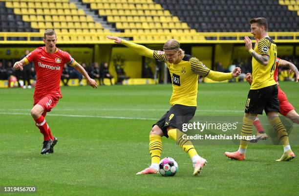 Erling Haaland of Borussia Dortmund scores their team's first goal during the Bundesliga match between Borussia Dortmund and Bayer 04 Leverkusen at...