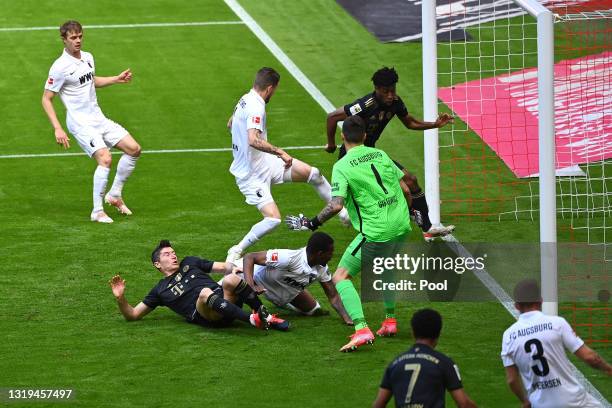 Kingsley Coman of FC Bayern Muenchen scores their side's first goal during the Bundesliga match between FC Bayern Muenchen and FC Augsburg at Allianz...