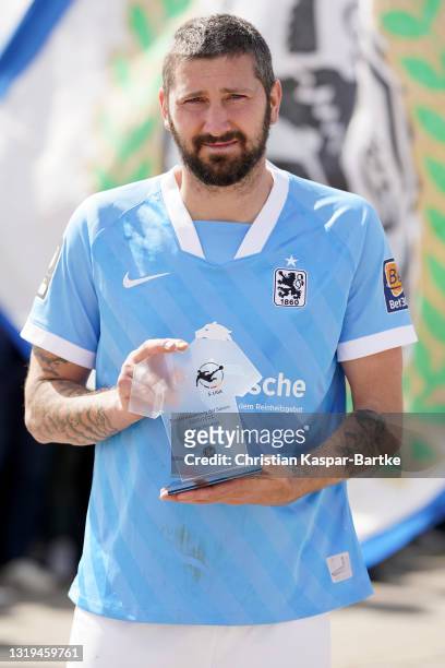 Sascha Mölders of TSV 1860 Muenchen is awarded as top scorer of the season after the 3. Liga match between FC Ingolstadt 04 and TSV 1860 München at...