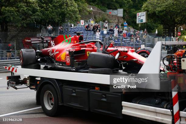 The car of Charles Leclerc of Monaco and Ferrari is seen on the back of a recovery truck after crashing on track during qualifying prior to the F1...