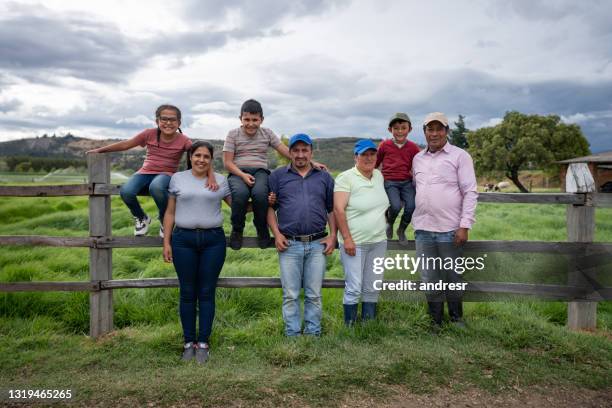 group of latin american people working in agriculture at a farm - farm workers in field stock pictures, royalty-free photos & images