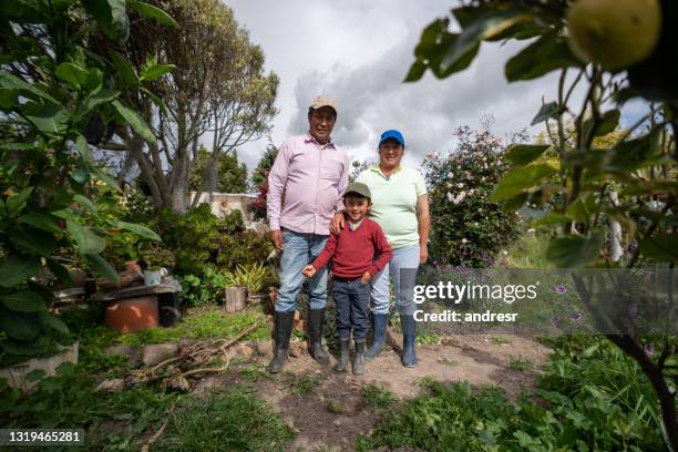 happy family of latin american farmers smiling outdoors - poor farmer stock pictures, royalty-free photos & images