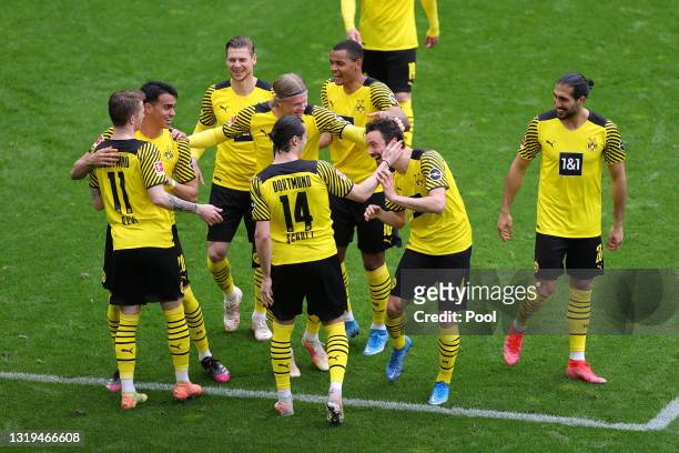 Marco Reus of Borussia Dortmund celebrates after scoring their team's second goal with his team mates during the Bundesliga match between Borussia...
