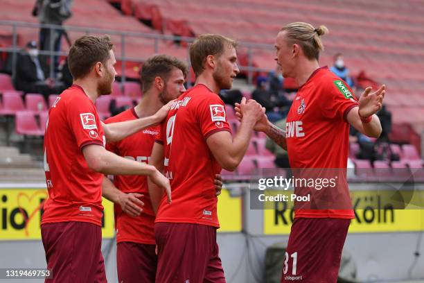 Sebastian Andersson of 1. FC Koeln celebrates with teammate Marius Wolf after scoring a goal which is then disallowed during the Bundesliga match...