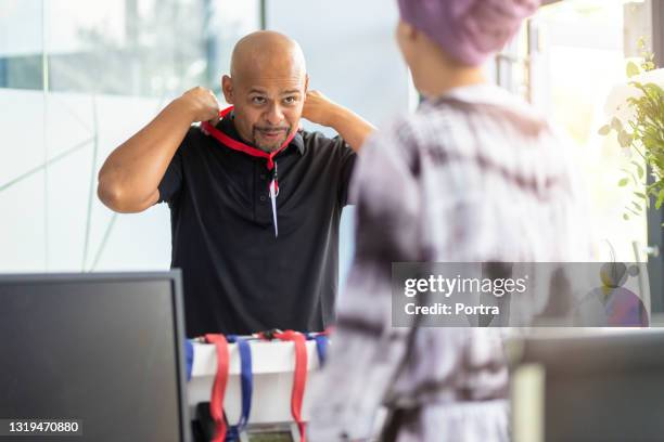 businessman attending a conference wearing his access badge - south africa press conference stock pictures, royalty-free photos & images