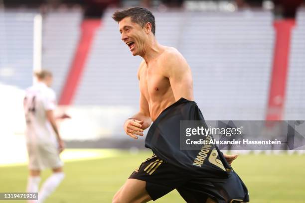 Robert Lewandowski of FC Bayern Muenchen celebrates after scoring their side's fifth goal, scoring his 41st league goal, breaking the record for the...
