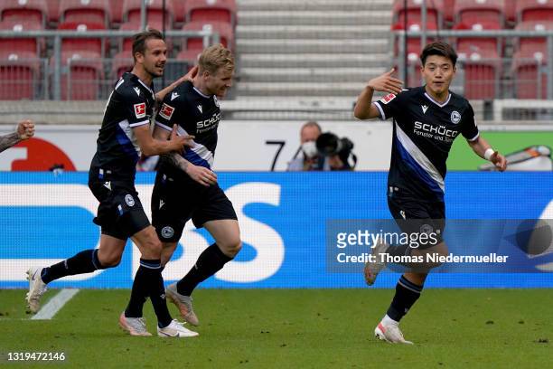 Ritsu Doan of Arminia Bielefeld celebrates after scoring their team's second goal with his team mates during the Bundesliga match between VfB...