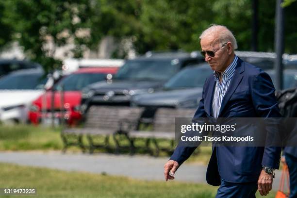 President Joe Biden walks on the Ellipse to board Marine One on May 22, 2021 in Washington, DC. President Joe Biden, first lady Jill Biden, son...