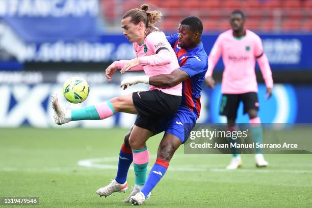 Antoine Griezmann of FC Barcelona battles for possession with Papakouli Diop of SD Eibar during the La Liga Santander match between SD Eibar and FC...