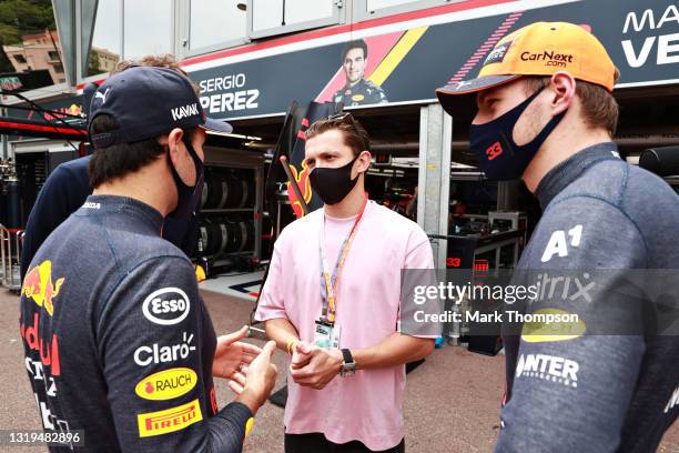 Max Verstappen of Netherlands and Red Bull Racing and Sergio Perez of Mexico and Red Bull Racing talk with actor Tom Holland ahead of final practice...