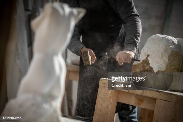 stonemason chiseling his sculpture - marble carving tools stock pictures, royalty-free photos & images