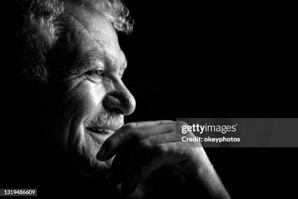 portret van rijpe turkse hand van de mens op gezicht - smiling mature eyes stockfoto's en -beelden