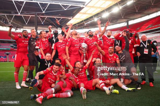 The Hornchurch squad celebrating with the FA trophy following their victory in the FA Trophy Final between Hereford and Hornchurch at Wembley Stadium...