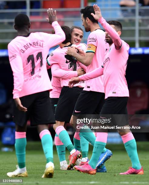 Antoine Griezmann of FC Barcelona celebrates after scoring their team's first goal with his team mates during the La Liga Santander match between SD...