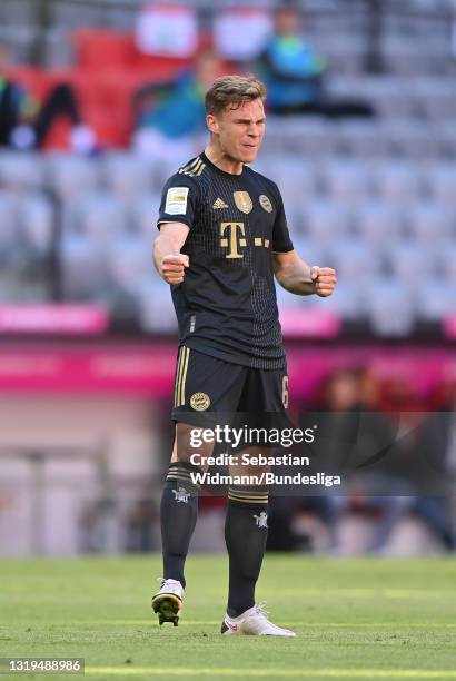 Joshua Kimmich of FC Bayern Muenchen celebrates after scoring their sides third goal during the Bundesliga match between FC Bayern München and FC...