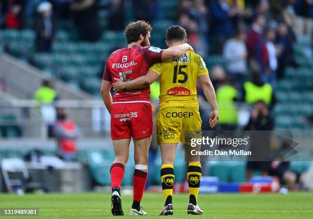 Maxime Medard of Toulouse and Brice Dulin of La Rochelle interact following the Heineken Champions Cup Final between La Rochelle and Toulouse at...