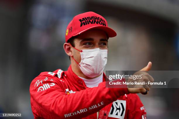 Pole position qualifier Charles Leclerc of Monaco and Ferrari celebrates in parc ferme during qualifying prior to the F1 Grand Prix of Monaco at...