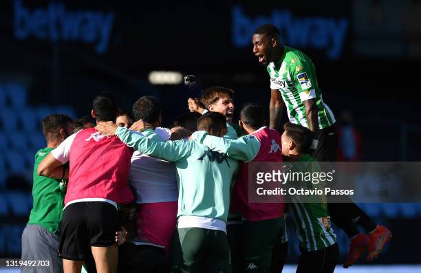 Real Betis players celebrate after victory in the La Liga Santander match between RC Celta and Real Betis at Abanca-Balaídos on May 22, 2021 in Vigo,...