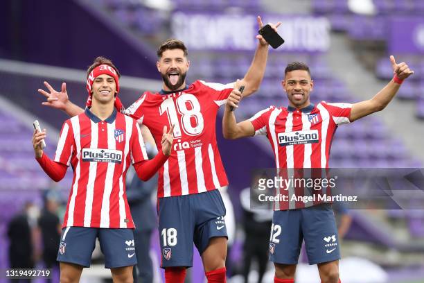Joao Felix, Felipe and Renan Lodi of Atletico de Madrid celebrate winning the La Liga Santander title after victory in the La Liga Santander match...
