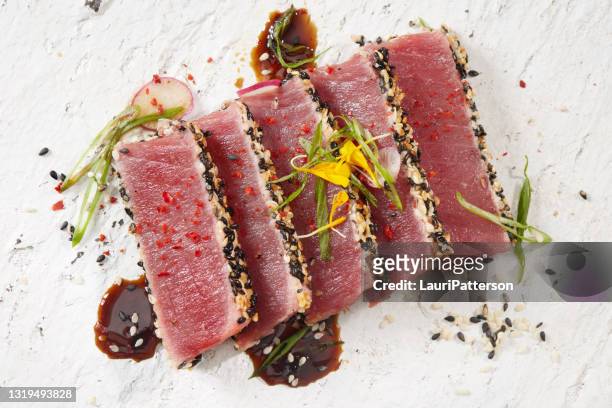 ahi tuna tataki with a soy vinegrette - tuna fish stock pictures, royalty-free photos & images