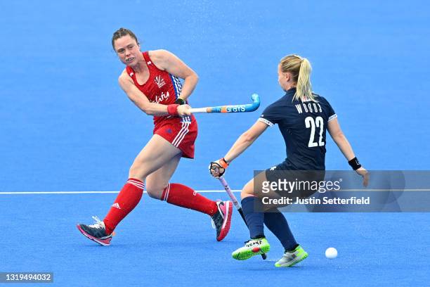 Grace Balsdon of Great Britain shoots past Nicole Woods of the United States during the FIH Hockey Pro League match between Great Britain Women and...