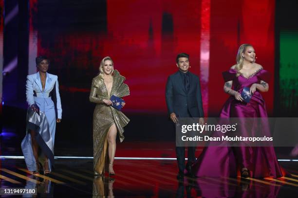 Presenters Edsilia Rombley, Chantal Janzen, Jan Smit and Nikkie de Jager on stage during the 65th Eurovision Song Contest grand final held at...