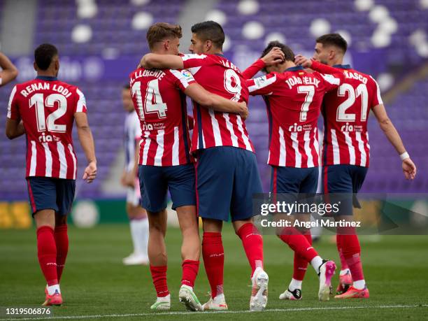 Luis Suarez of Atletico de Madrid celebrates with Marcos Llorente after scoring their side's second goal during the La Liga Santander match between...