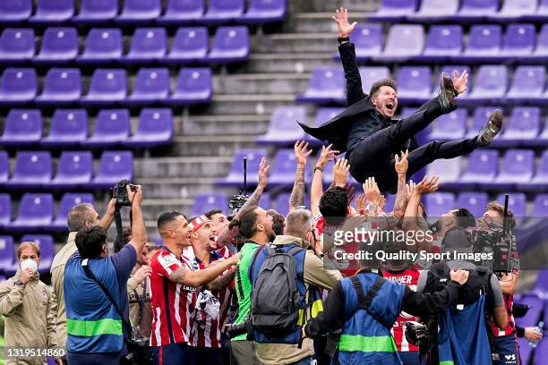 Diego Pablo Simeone, head coach of Atletico de Madrid is thrown by the air after winning LaLiga title at the end of the La Liga Santander match...