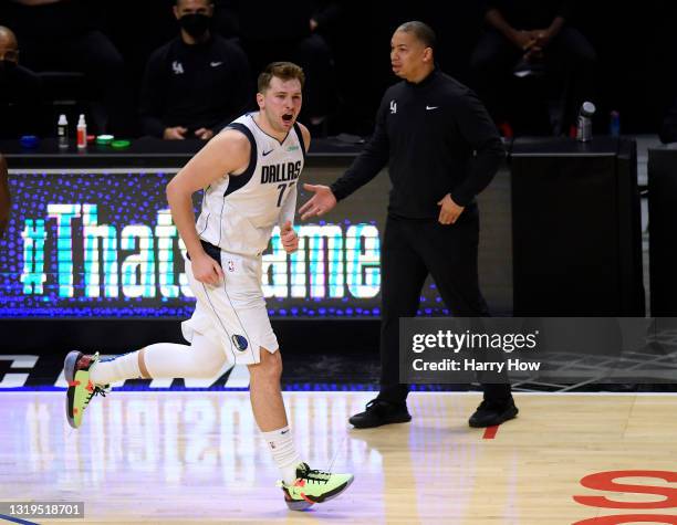 Luka Doncic of the Dallas Mavericks reacts to his three pointer with Tyronn Lue of the LA Clippers in the third quarter during game one of the...