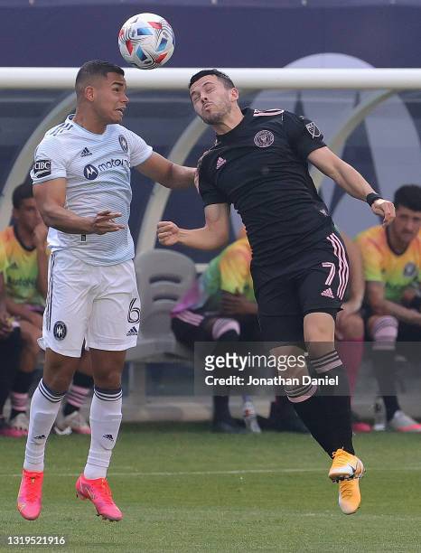 Miguel Angel Navarro of Chicago Fire heads the ball away from Lewis Morgan of Inter Miami at Soldier Field on May 22, 2021 in Chicago, Illinois.