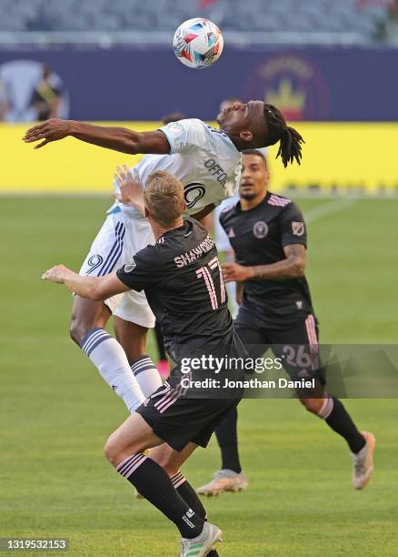 Chinonso Offor of Chicago Fire takes a pass off of his chest between Ryan Shawcross and Gregore of Inter Miami at Soldier Field on May 22, 2021 in...