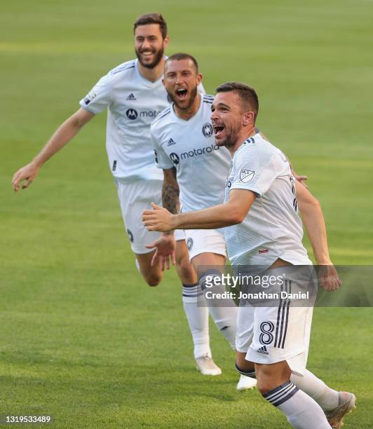 Elliot Collier, Francisco Calvo and Luka Stojanovic of Chicago Fire celebrate a goal by Stojanovic against Inter Miami at Soldier Field on May 22,...