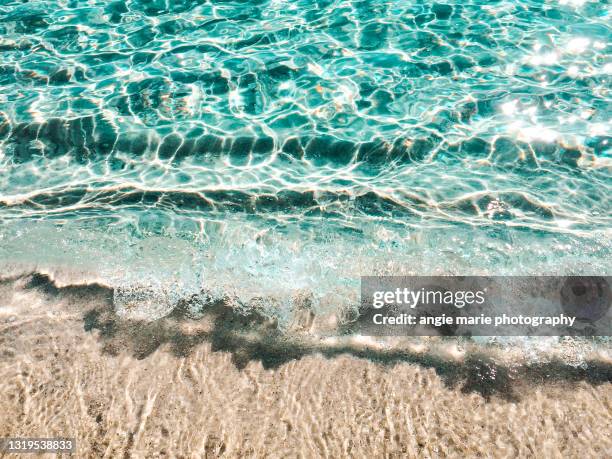 crystal seascape on the beach - wasserrand stock-fotos und bilder