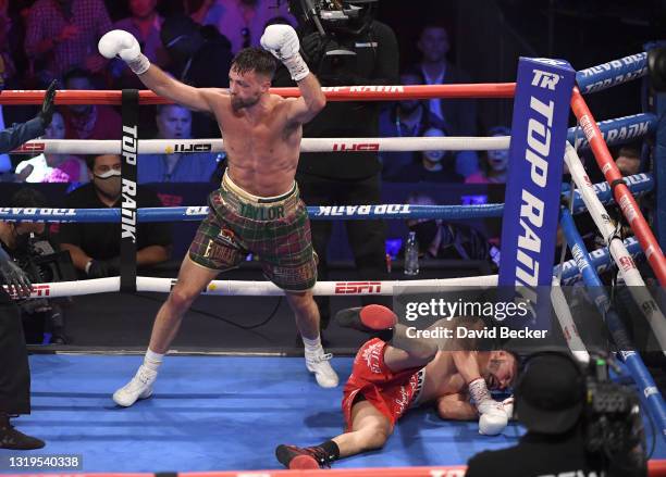 Josh Taylor reacts after knocking down Jose Ramirez during their junior welterweight world unification title fight at Virgin Hotels Las Vegas on May...