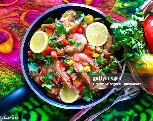 home cook portuguese arroz de marisco seafood rice. - arroz de pato stock pictures, royalty-free photos & images