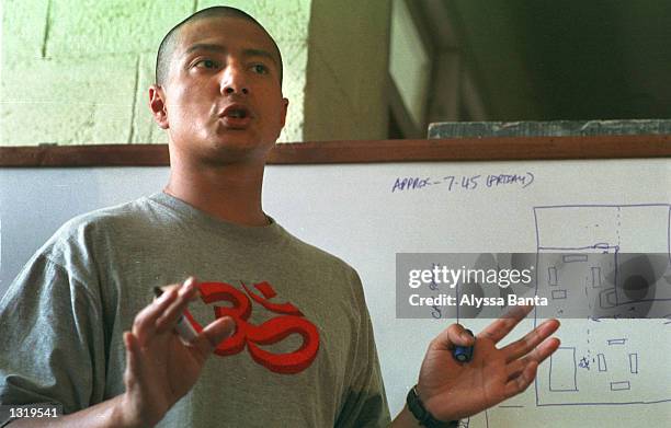 Dr. Rajiv Shahi points to a diagram June 7, 2001 during a press conference at the military hospital in Katmandu, Nepal. Shahi, husband to Princess...