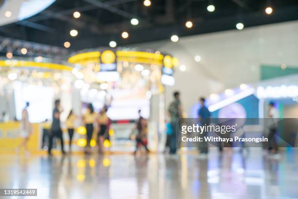 abstract blurred event with people for background - centro commerciale foto e immagini stock