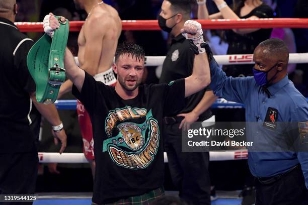 Josh Taylor poses with referee Kenny Bayless after his win by unanimous decision over Jose Ramirez in their junior welterweight world unification...