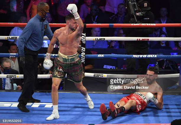 Josh Taylor reacts after knocking down Jose Ramirez during their junior welterweight world unification title fight at Virgin Hotels Las Vegas on May...